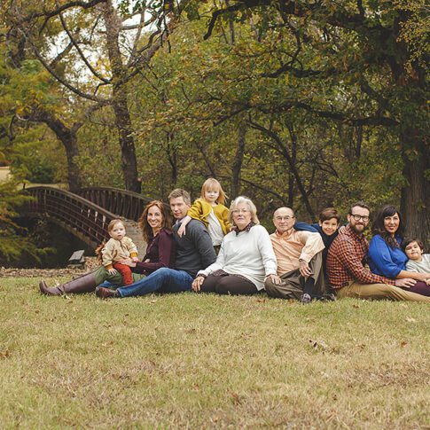 large family session sitting on the grass in the fall - plano family photography