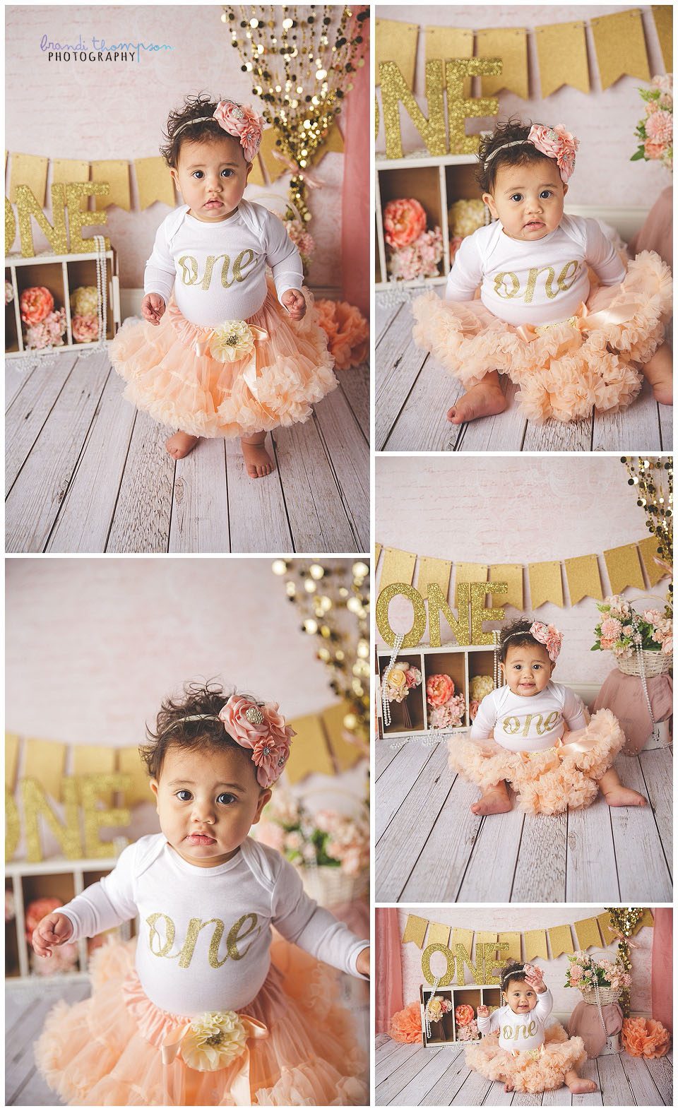 studio cake smash session with pink, peach, white and gold, and flowers. A medium skinned baby girl with curly brown hair