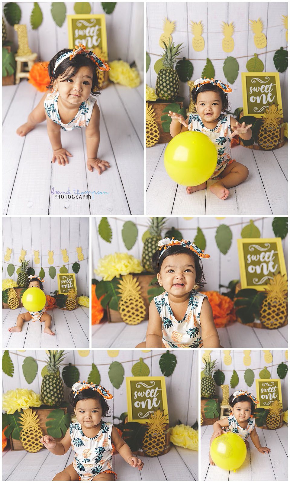one year old baby girl in studio with white plank backdroop and tropical pineapple decorations